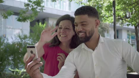 Happy-multiracial-couple-having-video-call-through-smartphone.
